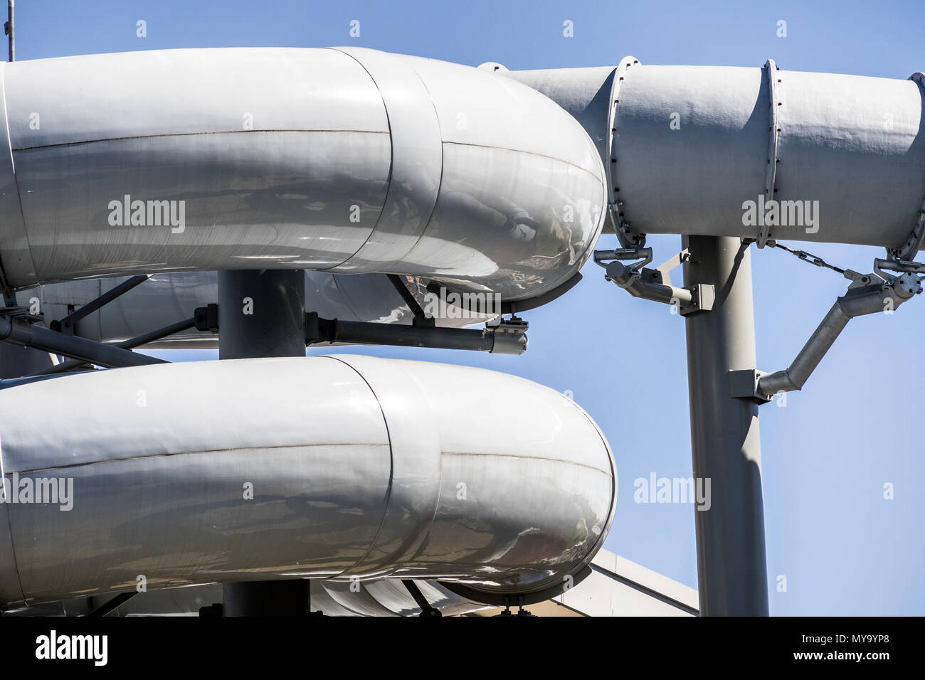 Detailed view of the serpentines of the tubes of a water slide of an indoor swimming pool, germany Stock Photo