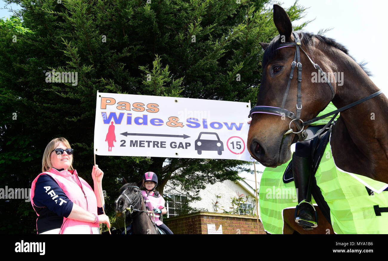 Local residents in the village of Binsted campaigning for motorists and other road users to allow more room for horses, Binsted, Hants, UK. 20.05.2018. Stock Photo