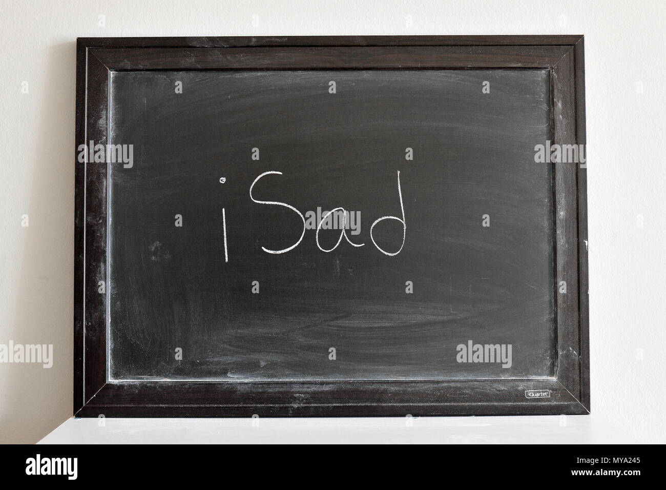 iSad written in white chalk on a blackboard Stock Photo