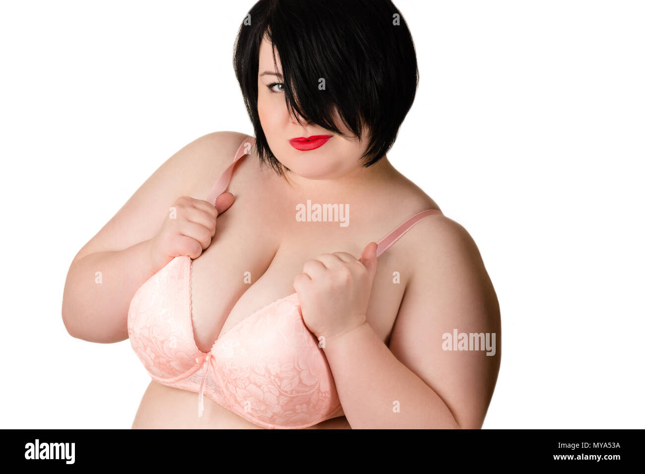 portrait beautiful fat woman with big breasts in beige bra Stock