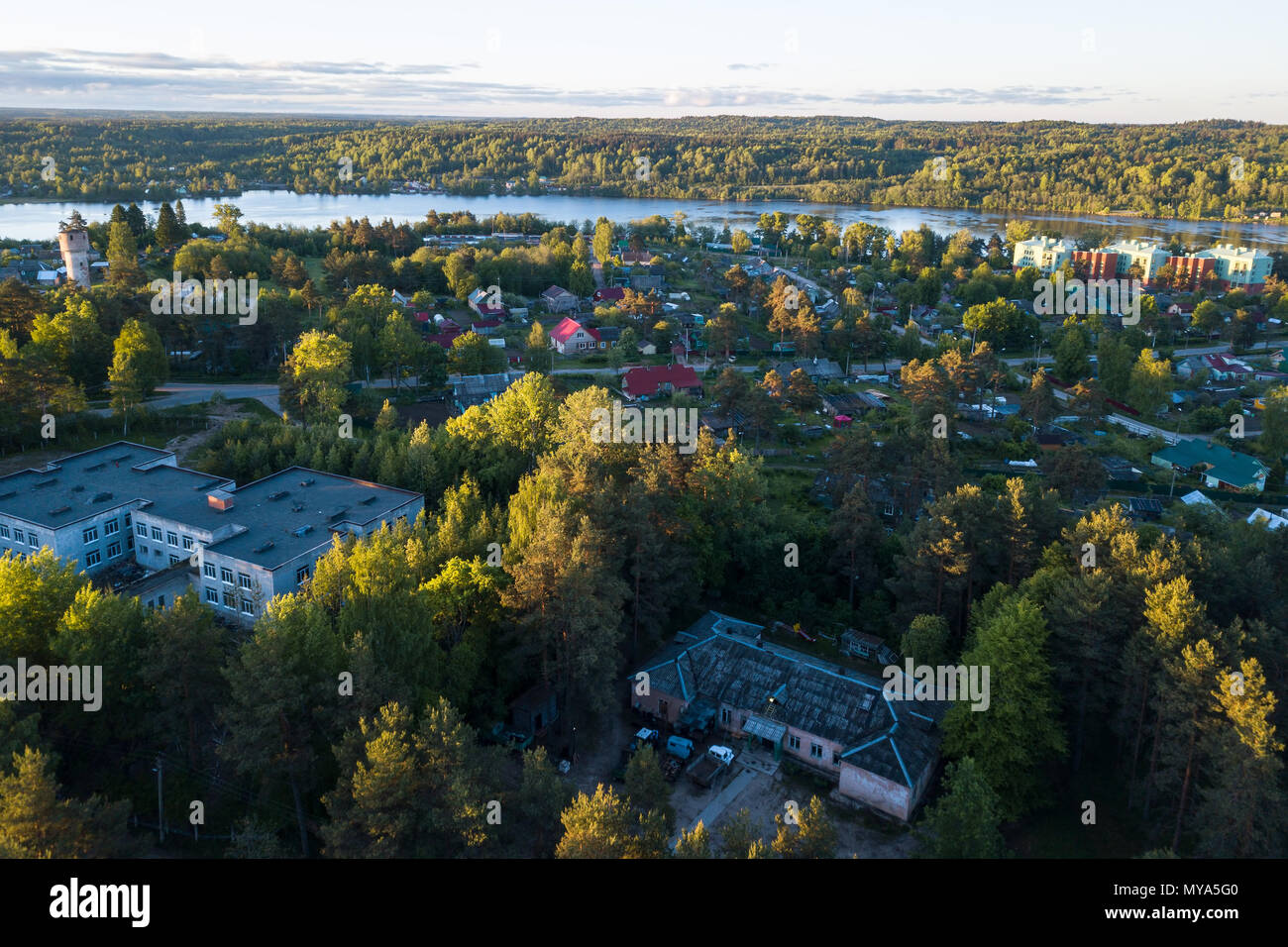 Aerial view of houses in urban-type settlement Nikolskiy and Svir river, Leningrad region, Russia. Stock Photo