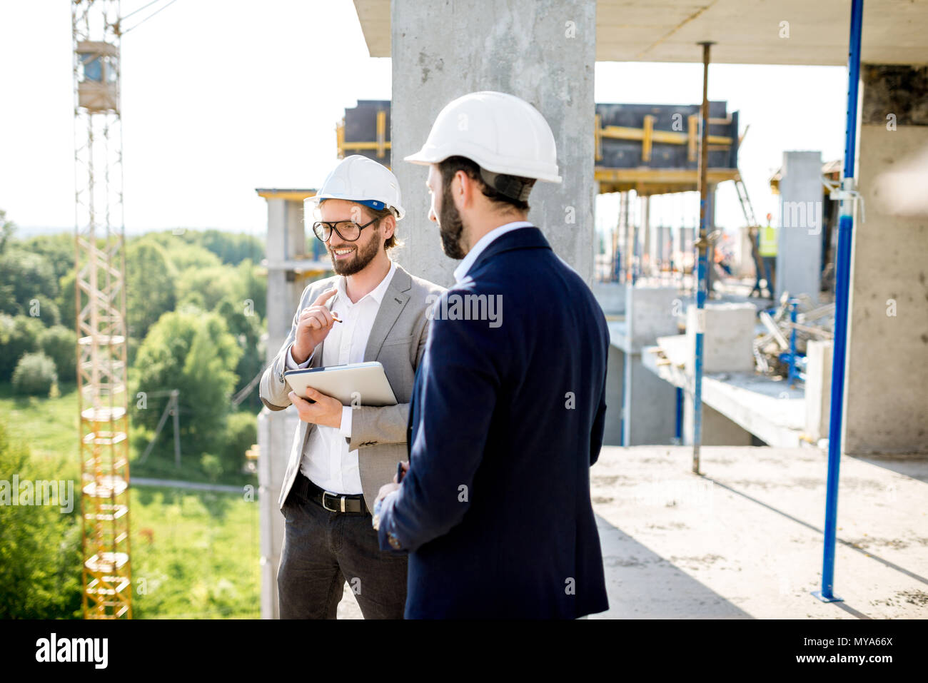Supervising the process of house construction Stock Photo