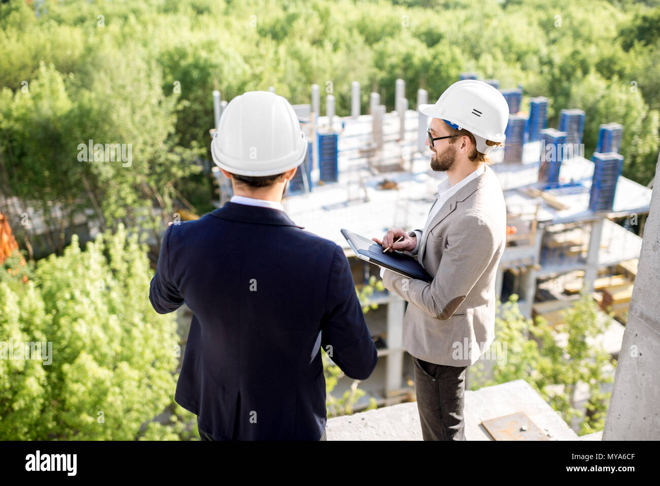 Supervising the process of house construction Stock Photo