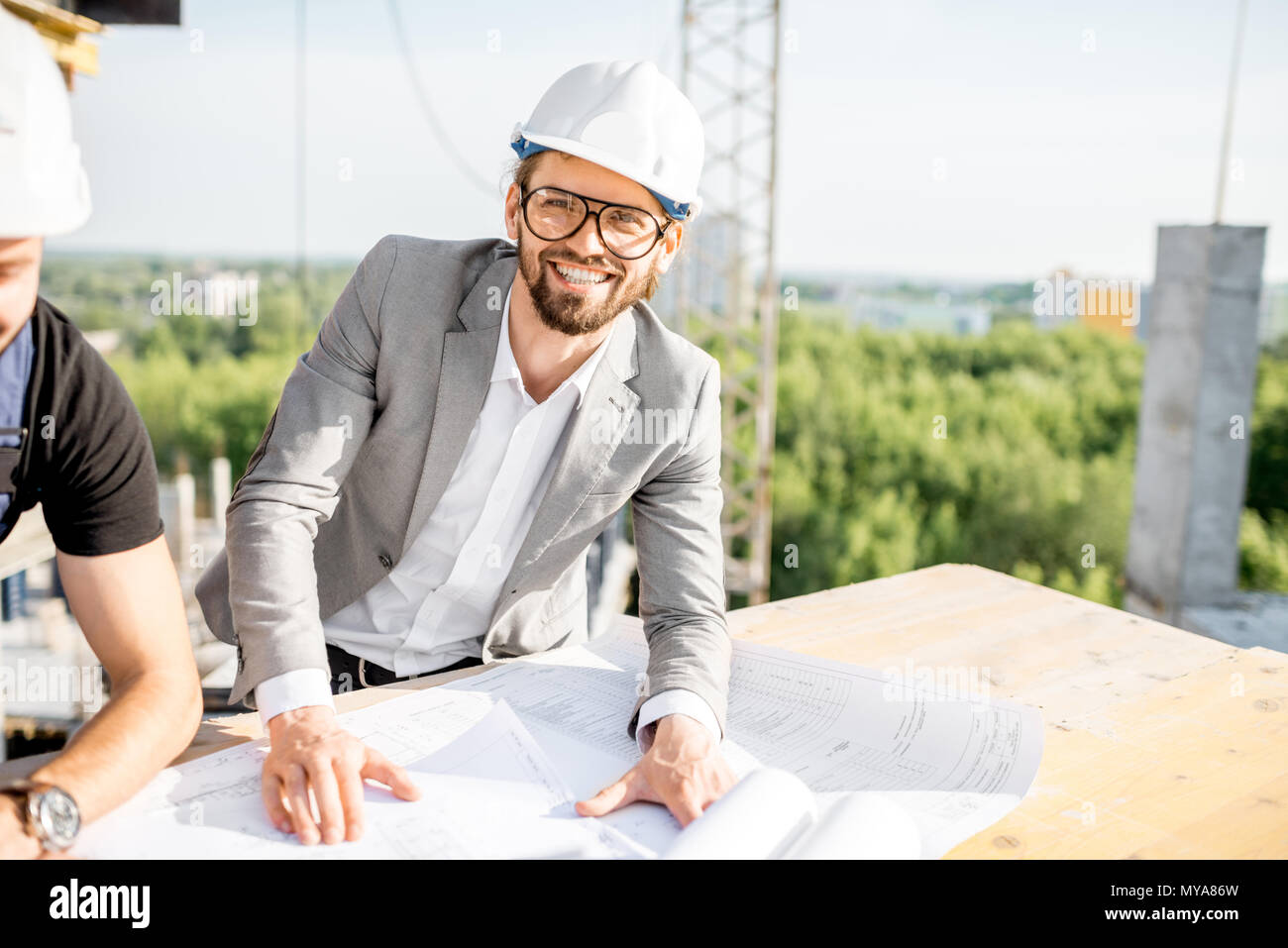 Engineer with drawings on the structure Stock Photo