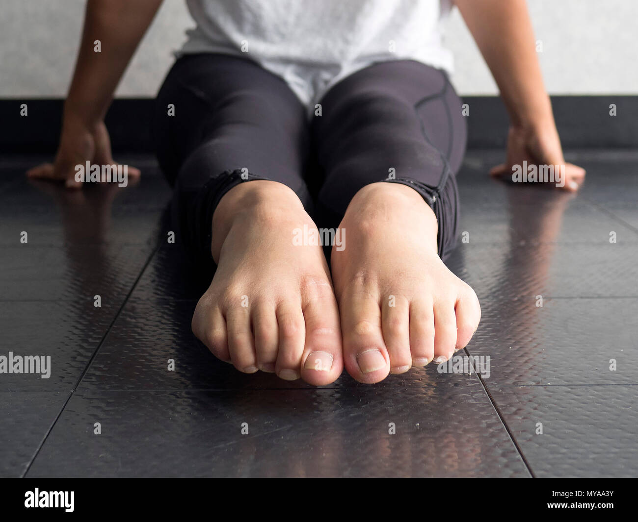 Close up of Dancer's pointed bare feet in the dance studio Stock Photo