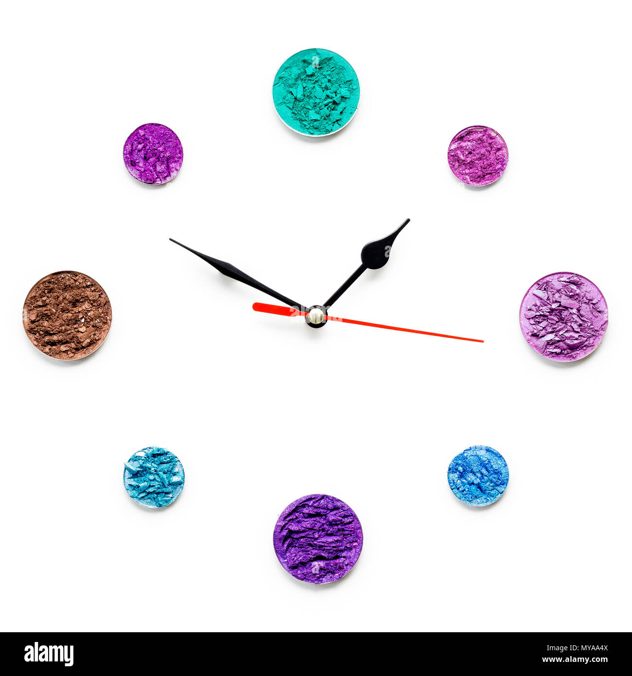 Creative concept photo of cosmetics swatches in the shape of clock on ...