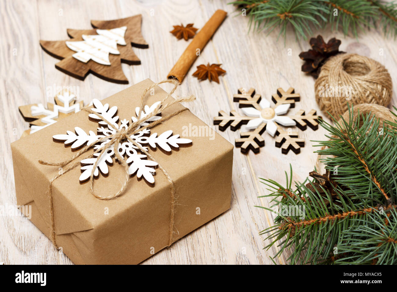 Christmas background with gift boxes wrapped in kraft paper, fir tree ...