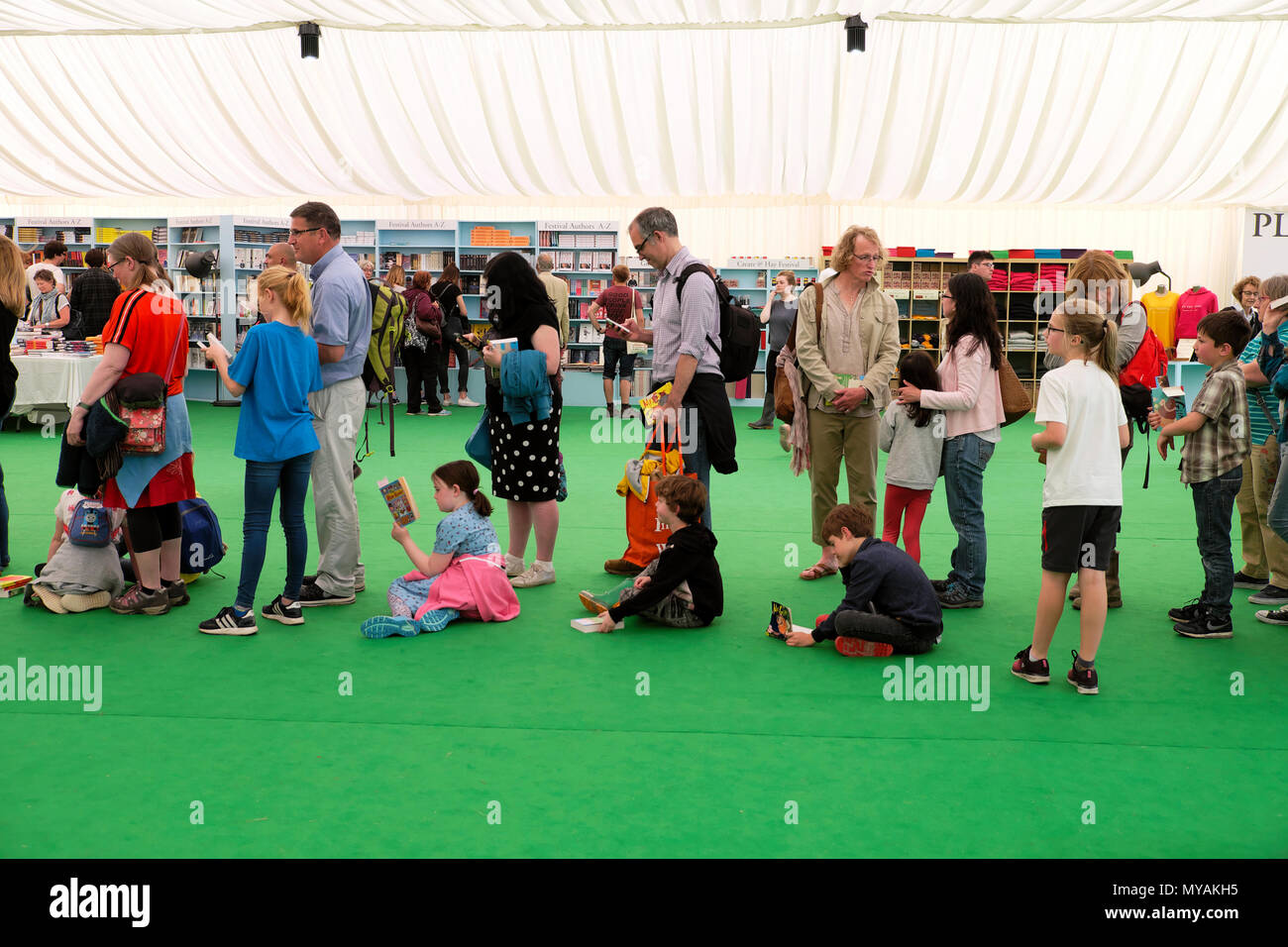 Families and children queue in the Hay Festival bookstore for childrens' author Andy Stanton to sign his book Natboff!  Hay-on-Wye  UK  KATHY DEWITT Stock Photo