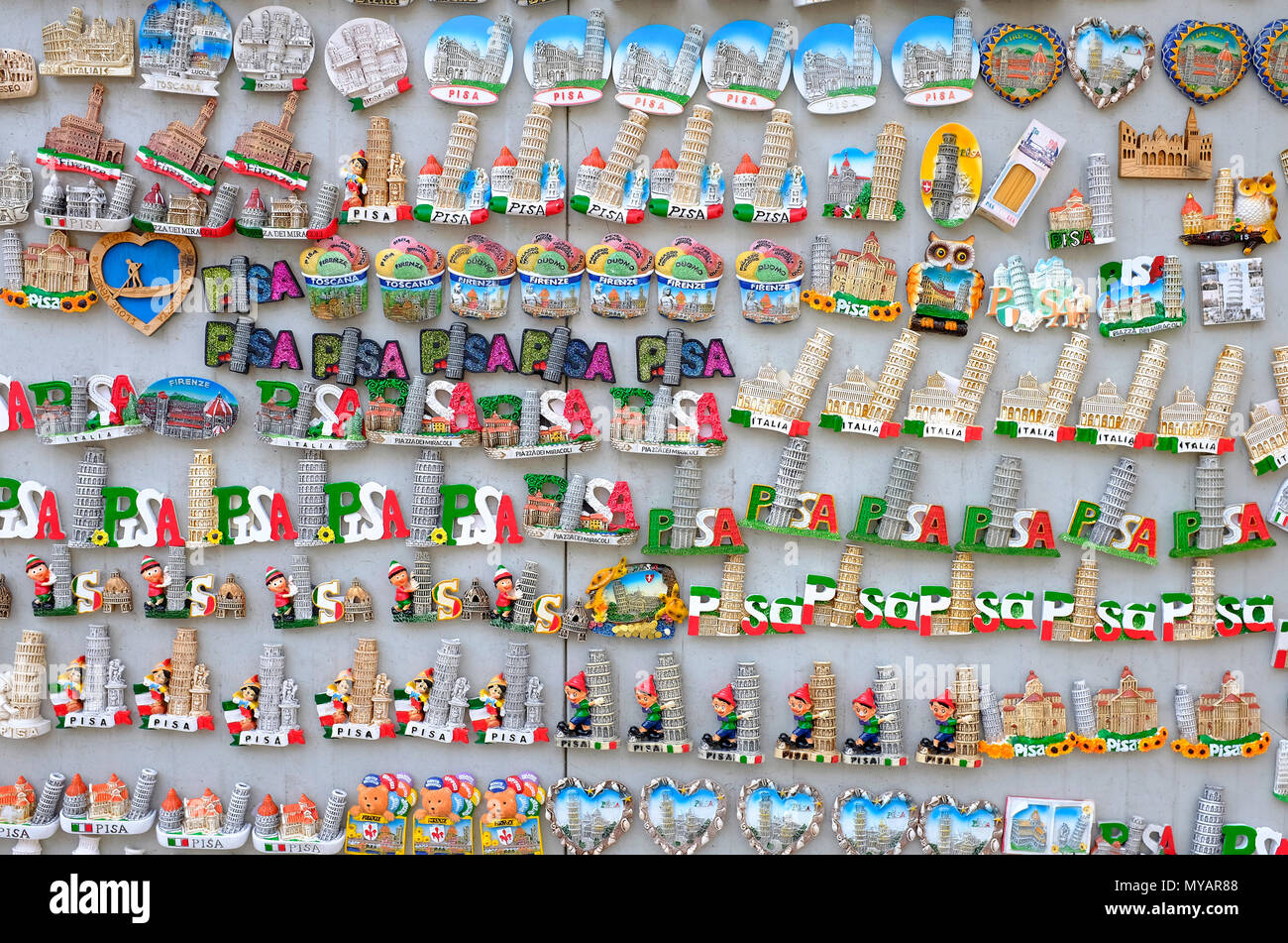 the leaning tower of pisa novelty souvenirs on market stall, tuscany