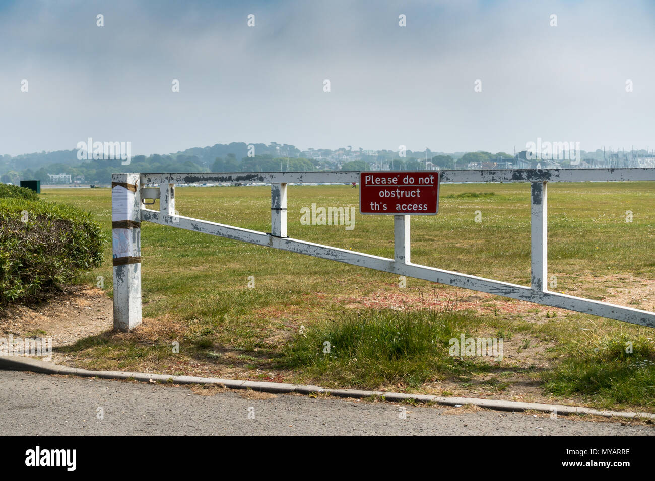 Please do not obstruct this access, British red notice on a gate in Poole, Dorset, United Kingdom Stock Photo