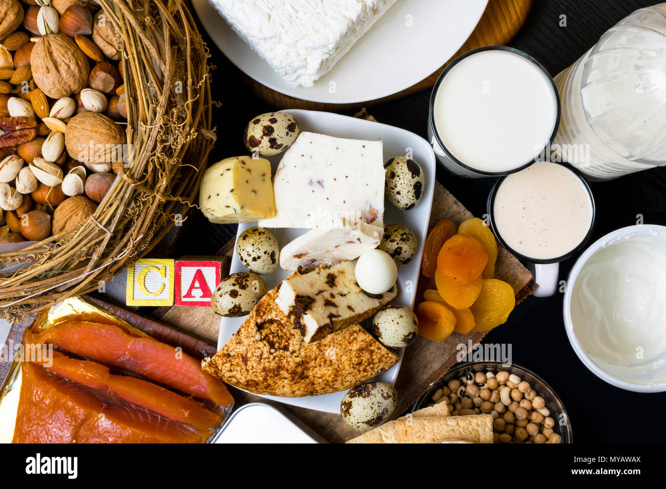 natural food rich in calcium such as nuts, milk, peas, sardines