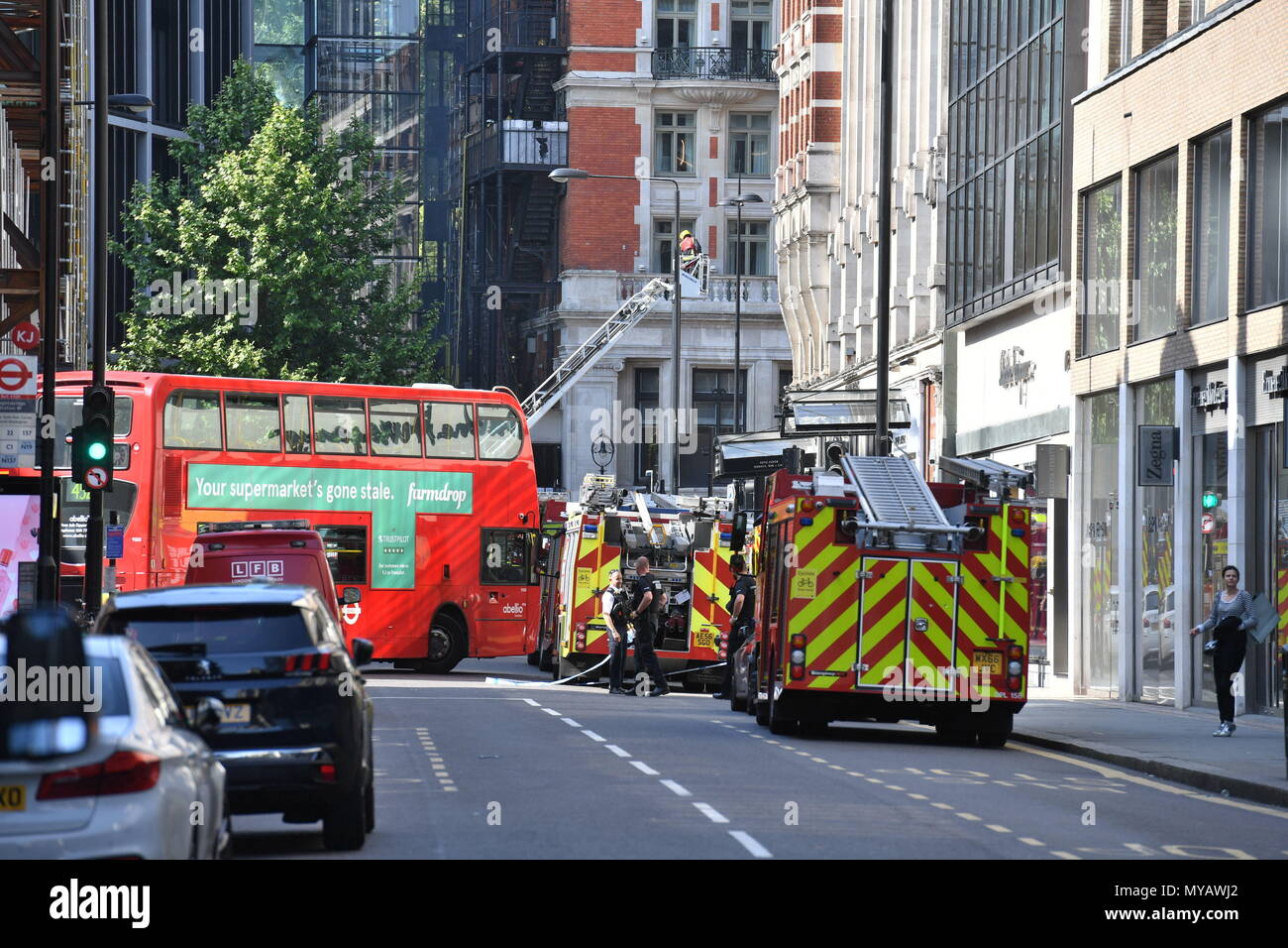 Emergency services in Sloane Street, Knightsbridge, central London, as London Fire Brigade said fifteen fire engines and 97 firefighters and officers have been called to a fire. Stock Photo