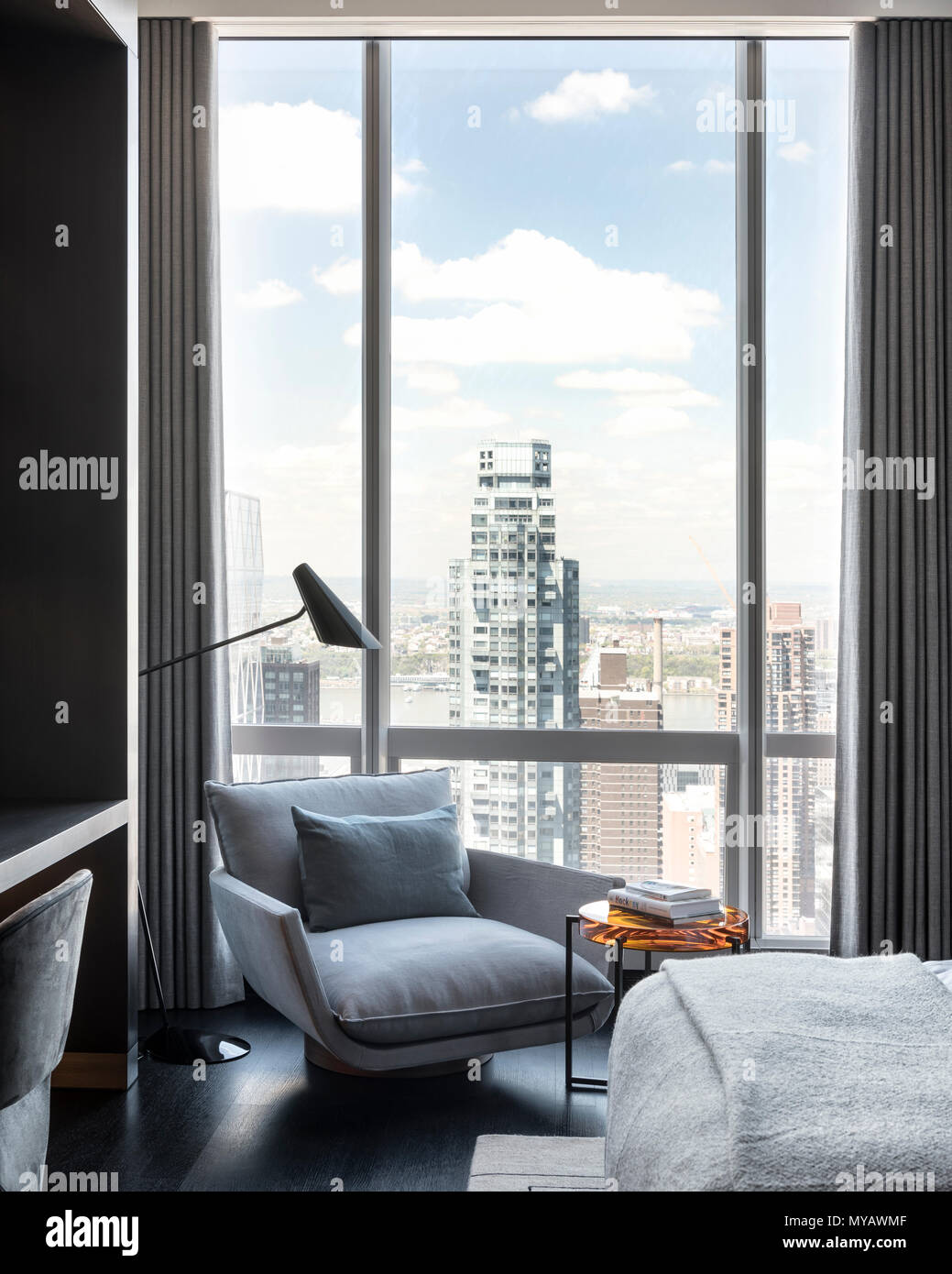 'Armchair by apartment window in New York City, USA' Stock Photo