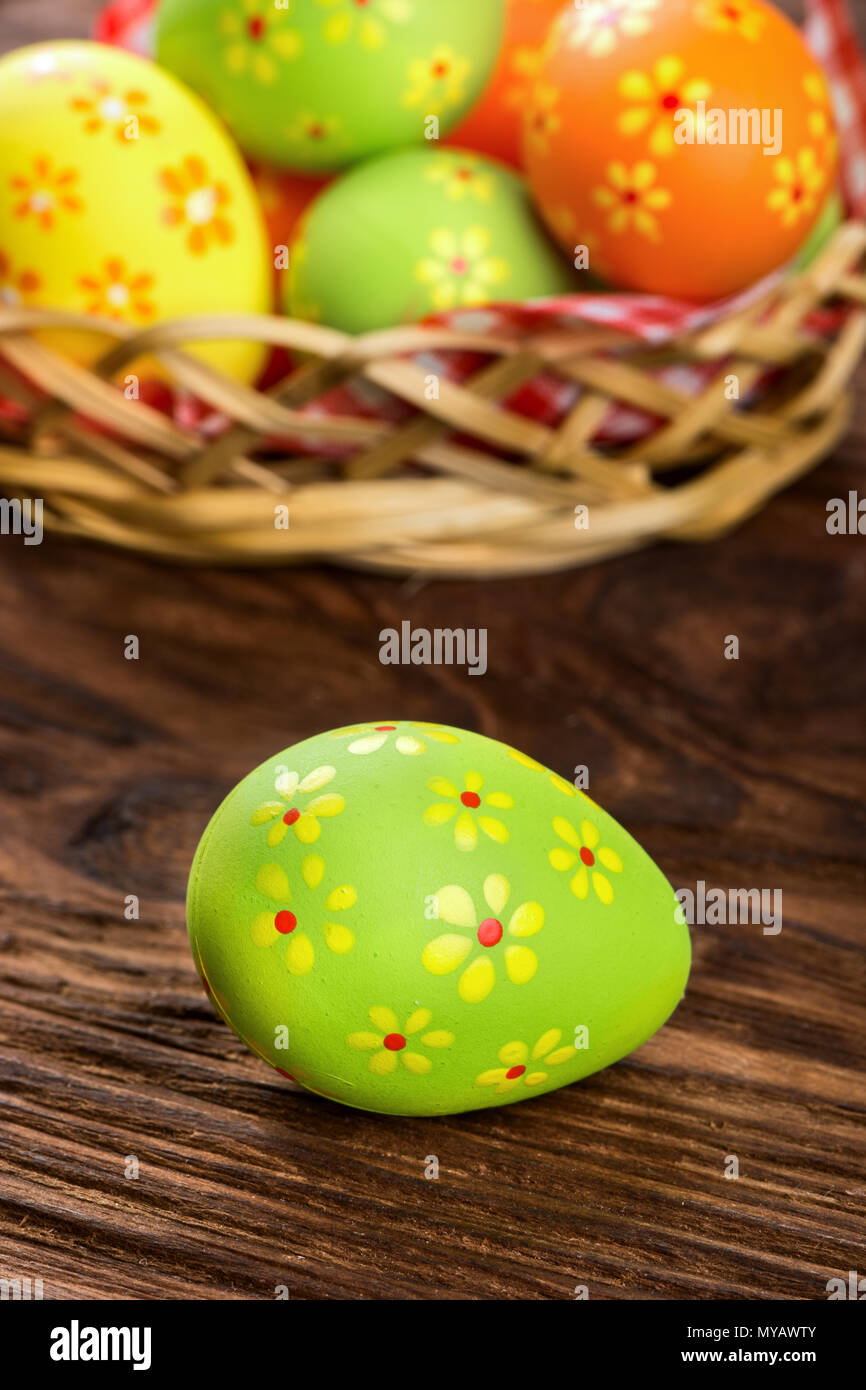 Green Easter egg with flower pattern on a background of a basket Stock ...