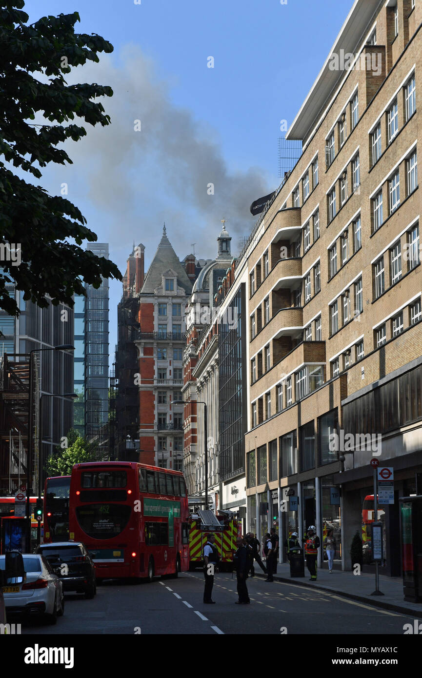 Emergency services in Sloane Street, Knightsbridge, central London, as London Fire Brigade said fifteen fire engines and 97 firefighters and officers have been called to a fire. Stock Photo