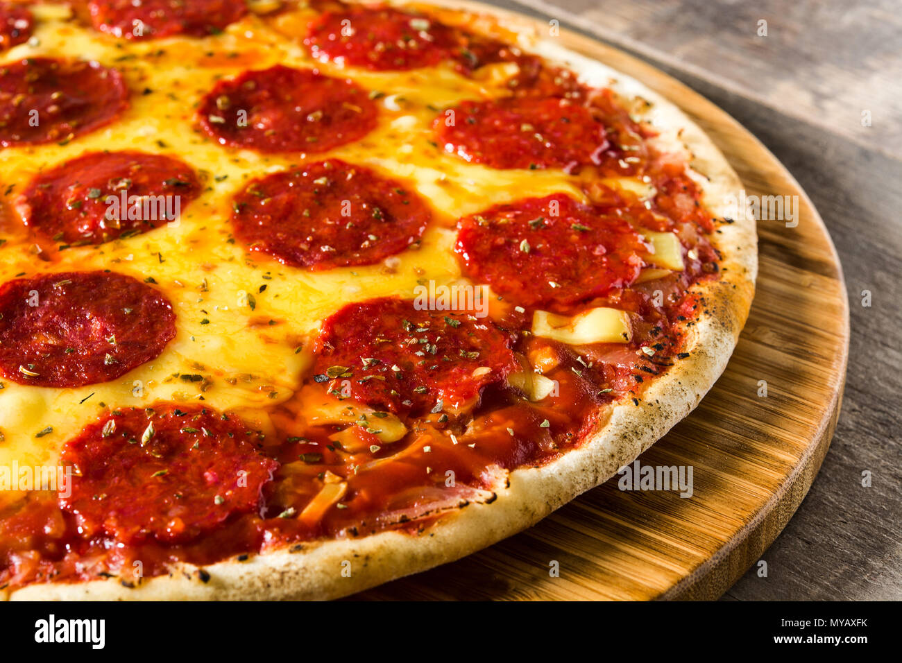 Hot italian pepperoni pizza on wooden table Stock Photo Alamy