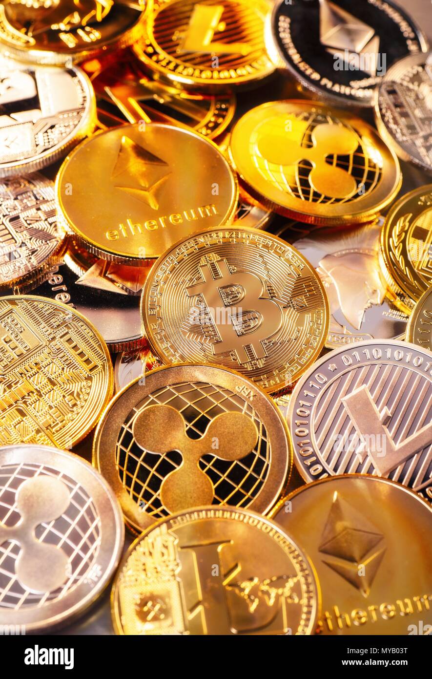 Many coins of various cryptocurrencies | usage worldwide Stock Photo
