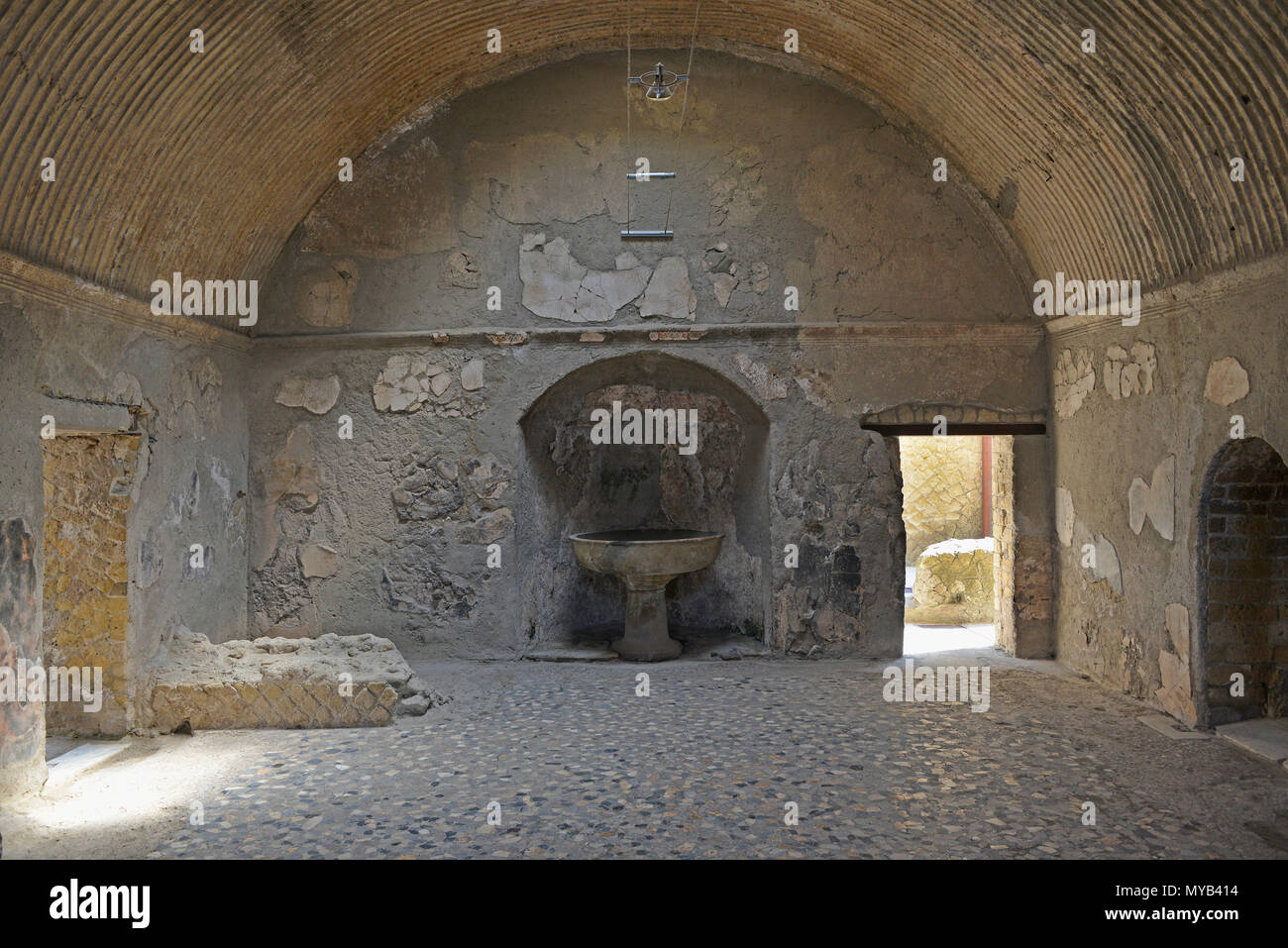 Interior of the public bath (central thermae), the apodyterium, at Herculaneum, showing vaulted ceiling and niche with a labrum of cipolin, Italy Stock Photo