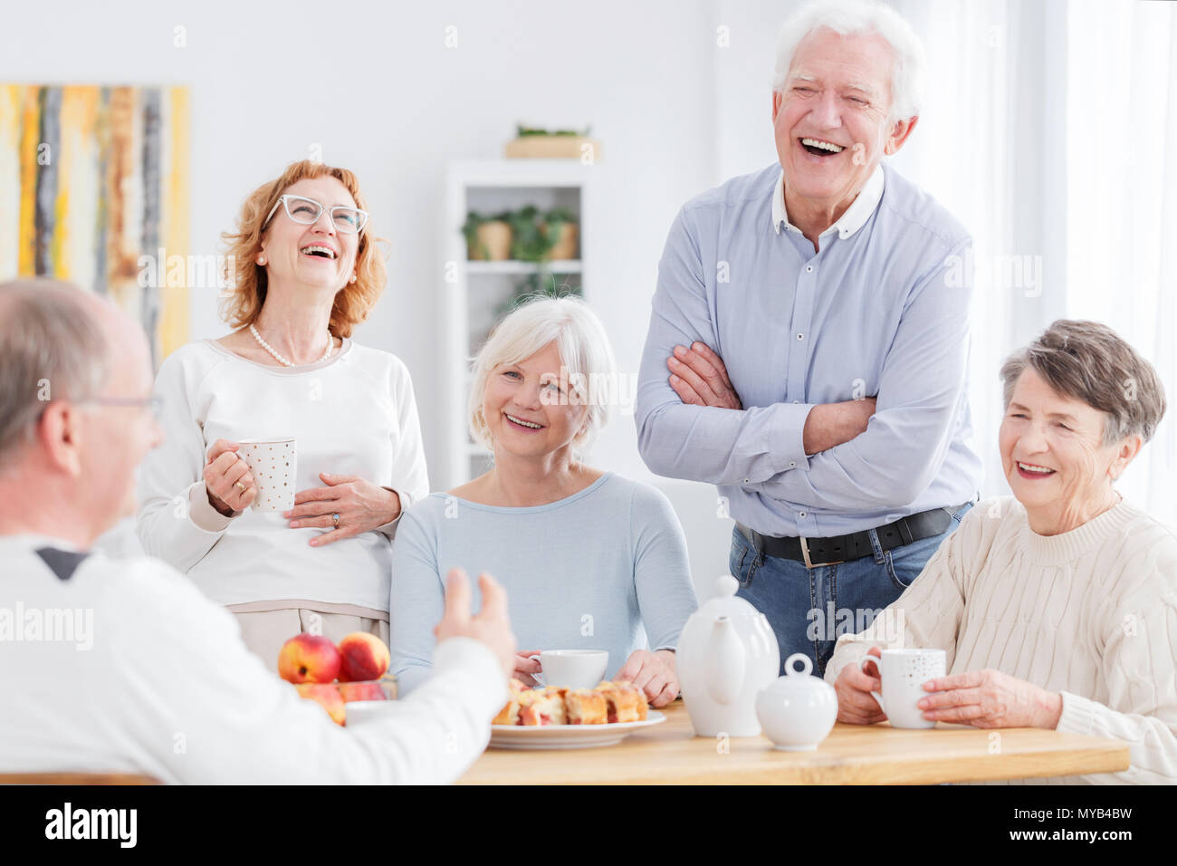 Group of happy older people laughing together on a meeting Stock Photo