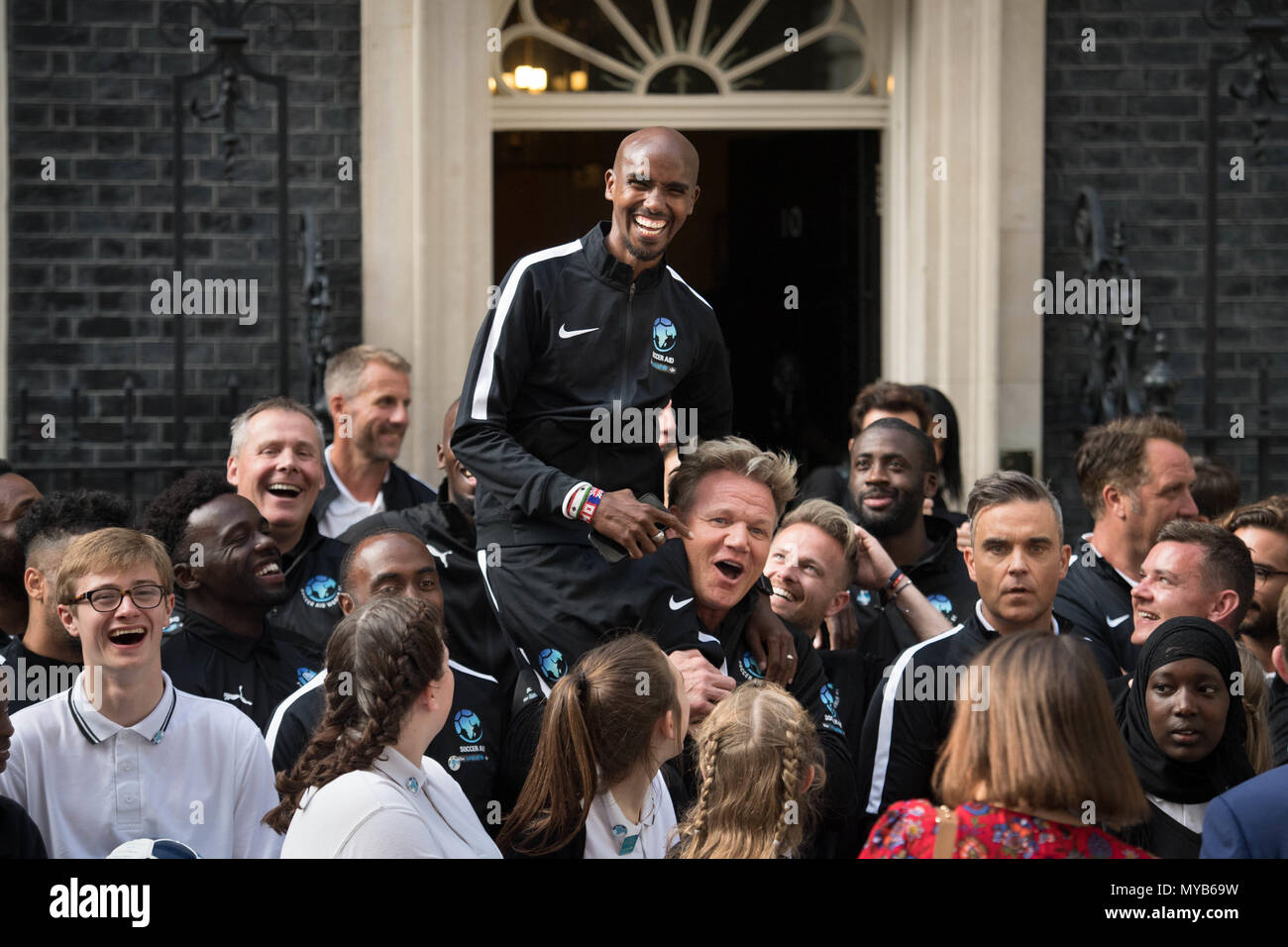 Mo Farah Being Lifted By Gordon Ramsay Outside The Door Of 10