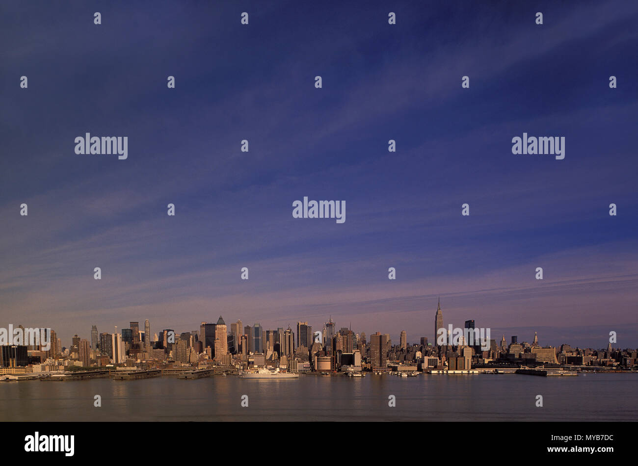 Midtown Manhattan skyline as seen from New Jersey across the Hudson River with cloudscape, New York, NY, USA Stock Photo