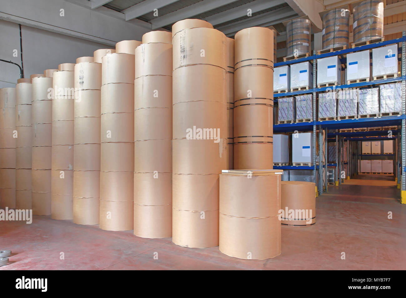 Big Stack Of Printing Paper Rolls In Warehouse Stock Photo