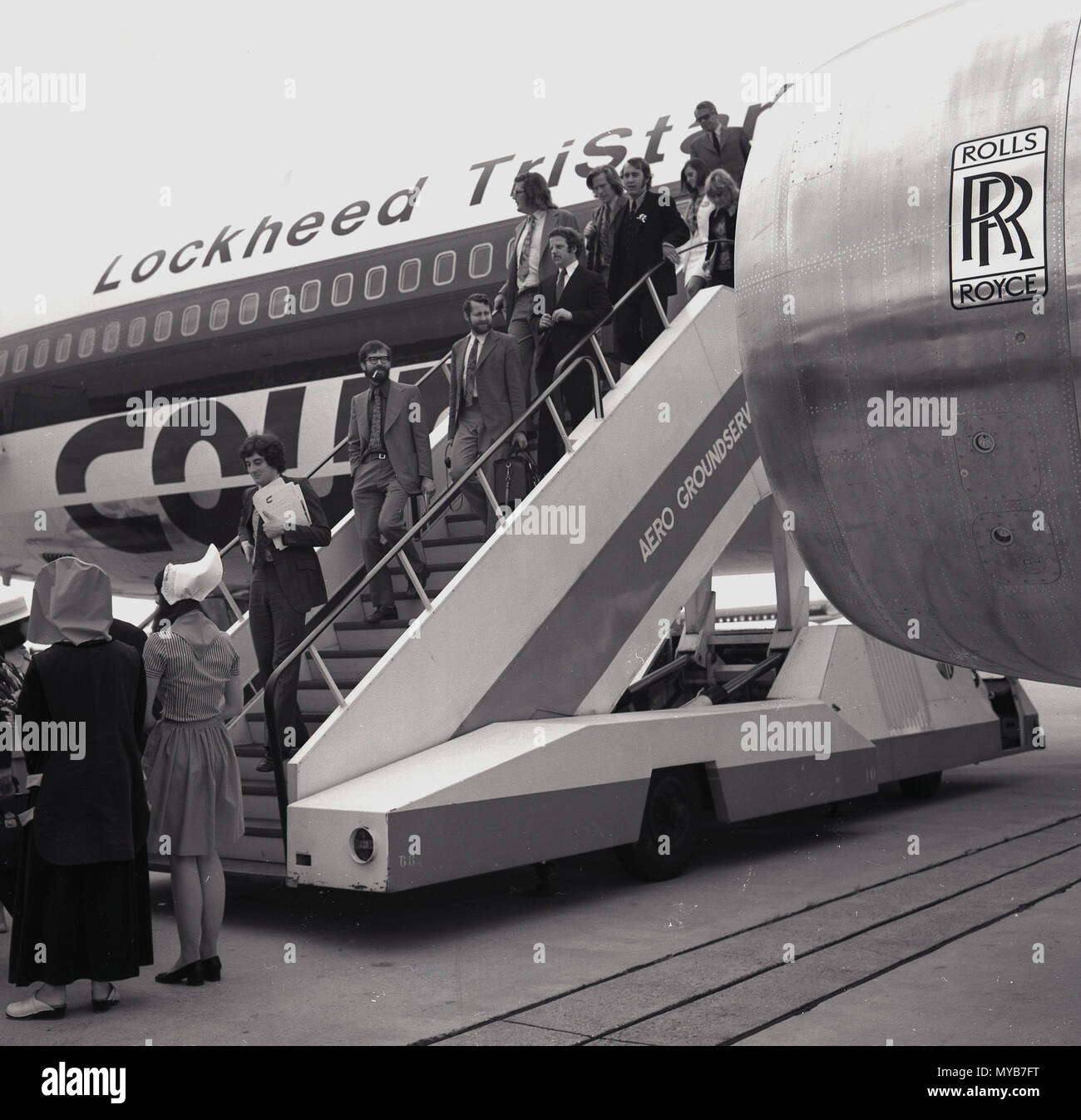1973, historical, passengers disembarking from a Lockheed Tristar airplance (L-1011), the most technologically-advanced widebody commercial aircraft in the world. Court Line Aviation, a British holiday charter company, were the first European airline to operate the Lockheed widebody. The TriStar was powered by the Rolls-Royce RB211 engine, a three-spool engine capable of generating incredible thrust. Stock Photo