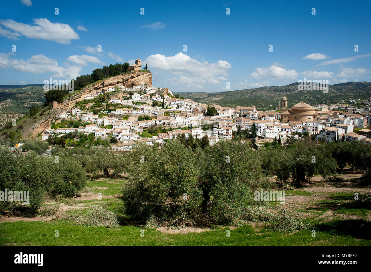 The spectacular Spanish town of Montefrio with its whitewashed houses and its sixteenth century clifftop church in the Granada region of Andalusia. Stock Photo