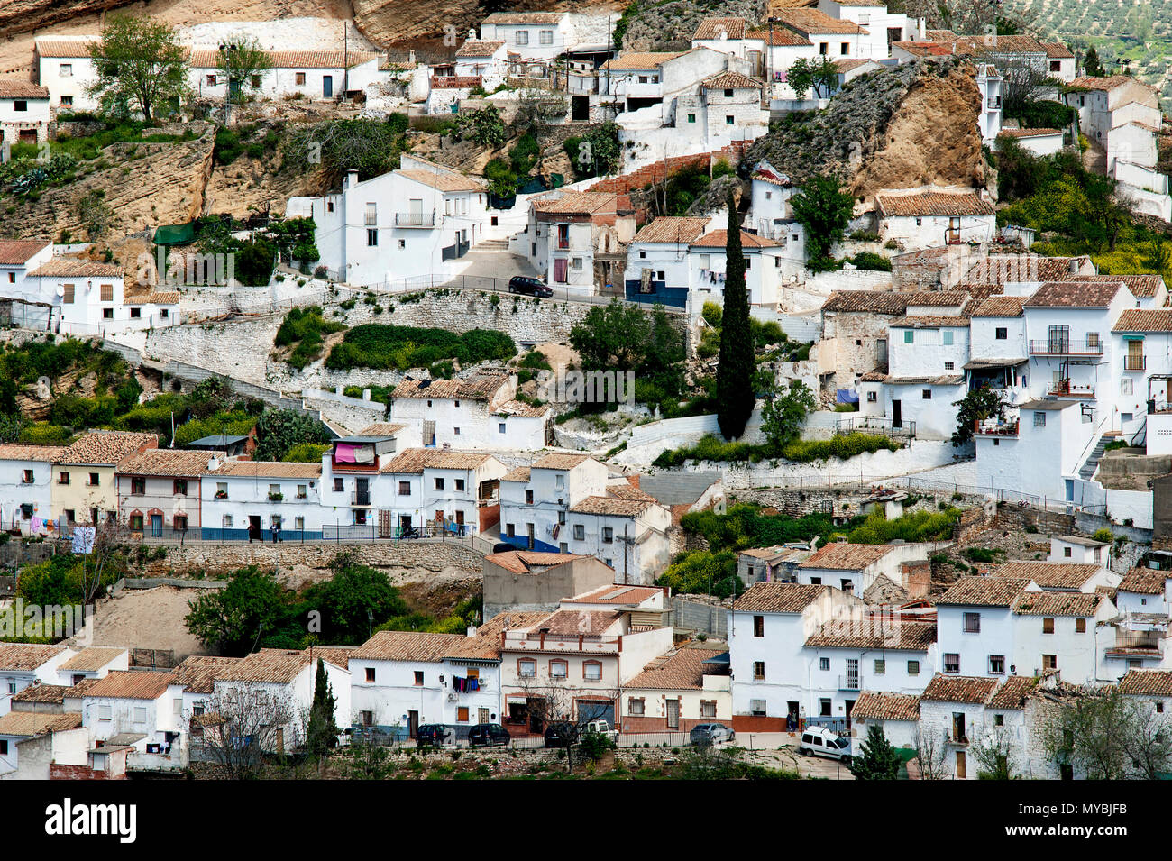 The picturesque Spanish town of Montefrio with its traditional whitewashed houses rising up the side of a hill in the Granada region of Andalucia. Stock Photo