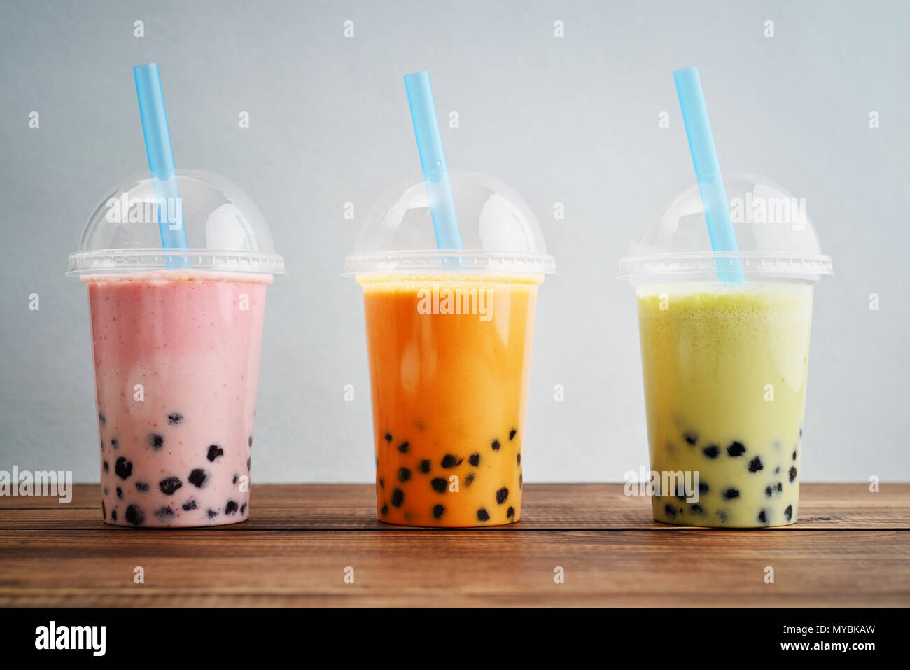 Variety Of Bubble Tea In Plastic Cups With Thick Straws Stock Photo,  Picture and Royalty Free Image. Image 81599835.