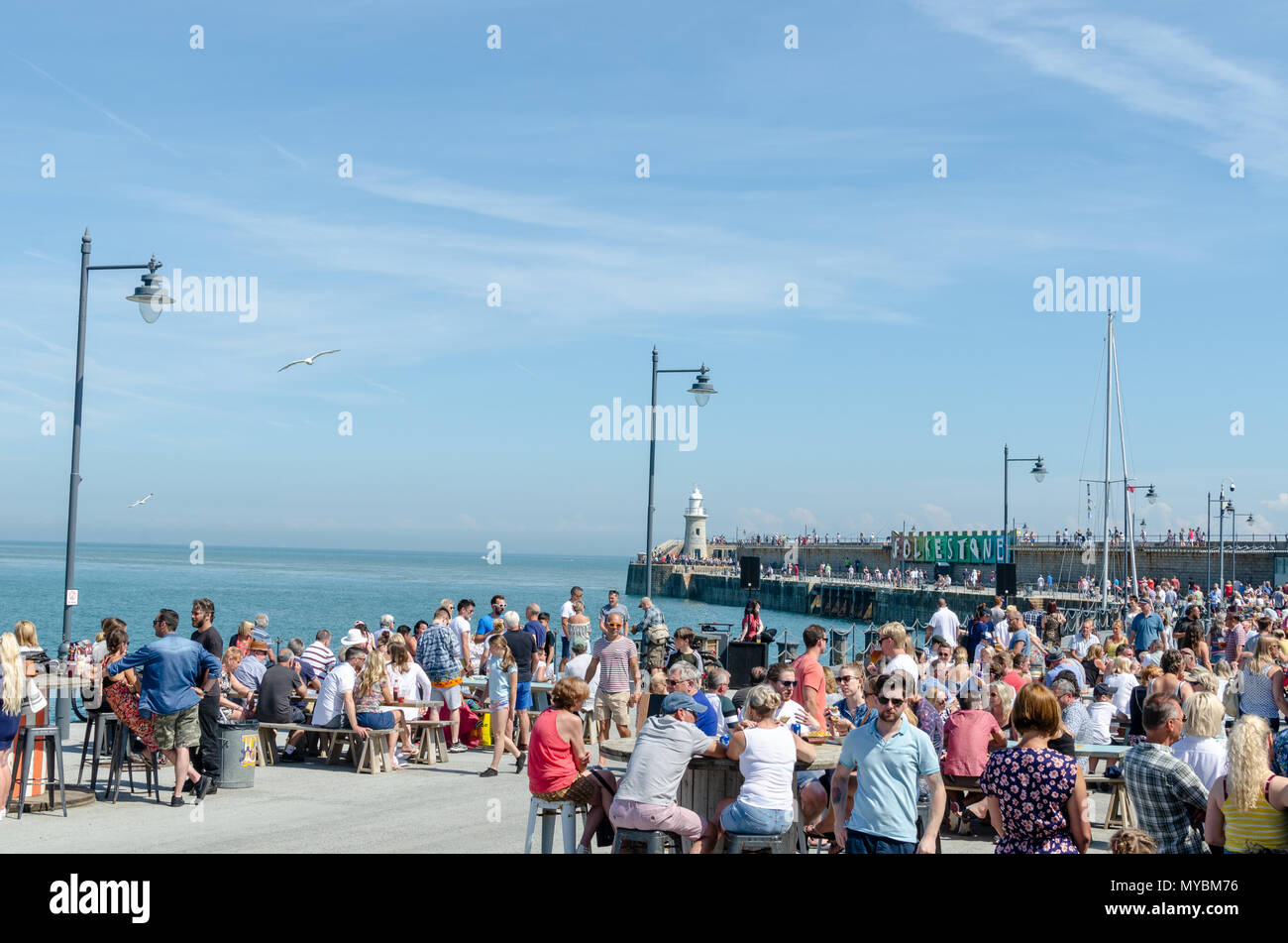 Tourists at the Folkestone Harbour Arm in Kent by the English Channel Stock Photo