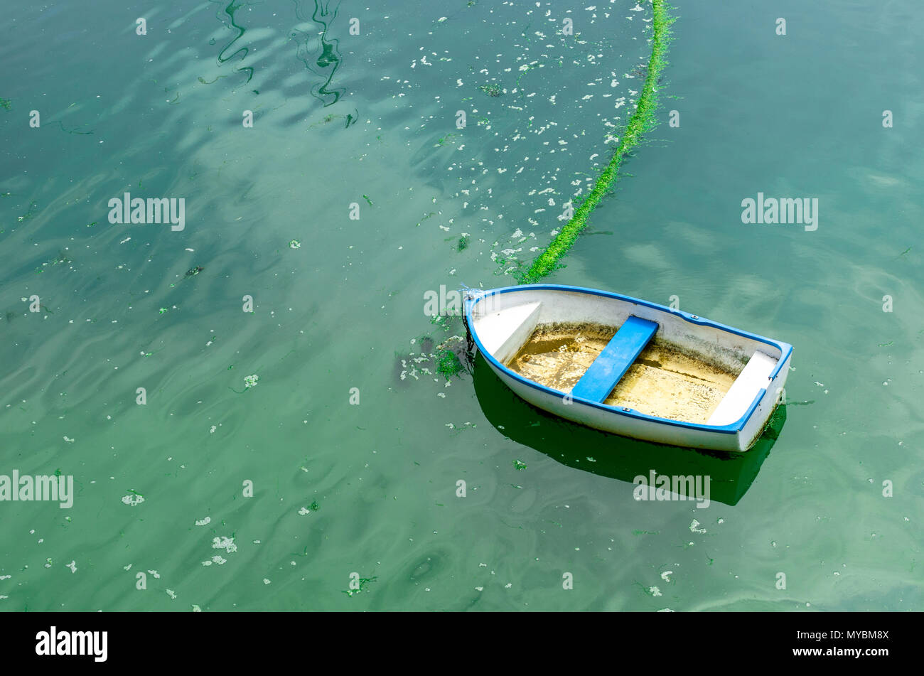 A wooden boat on turquoise waters Stock Photo