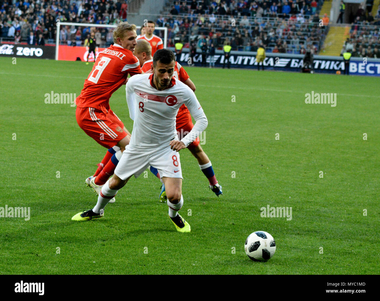 Moscow, Russia - June 5, 2018. Russian right back Igor Smolnikov and defensive midfielder Yury Gazinsky  against Turkish midfielder Oguzhan Ozyakup du Stock Photo