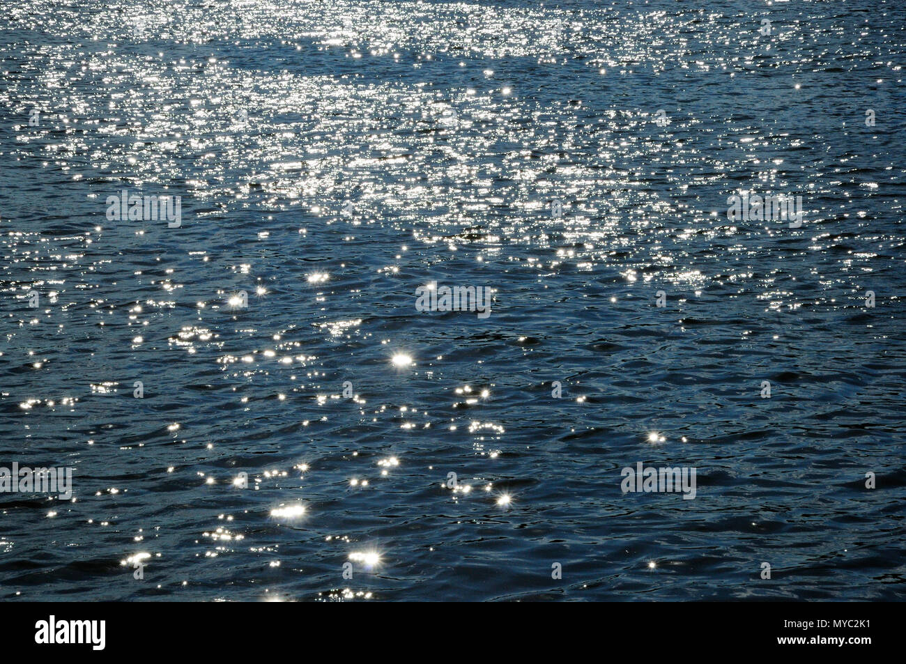 Sunshine reflecting off river Stock Photo