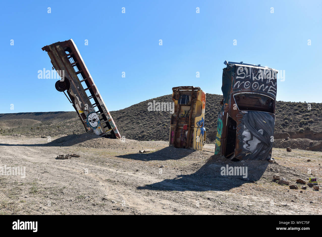 Junk car artistically buried in the desert near Goldfield Nevada Stock Photo