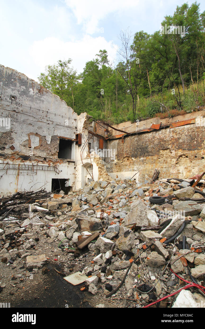 Demolition of the old factory building from stones and bricks Stock ...