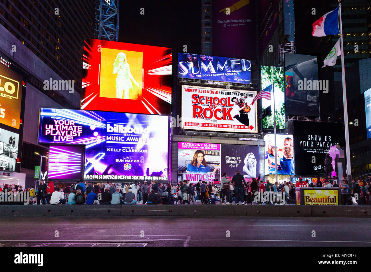 Times square Musicals advertised on neon signs colorful and brightly lit at night,  Times Square, Broadway, York city USA Stock Photo