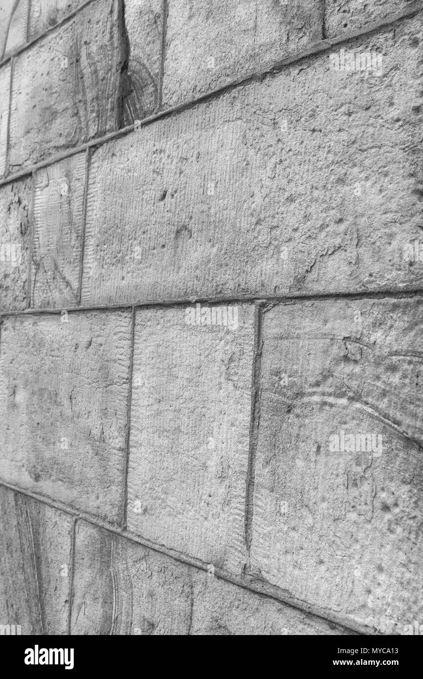 Monochrome version of sandstone block wall. Stock Photo