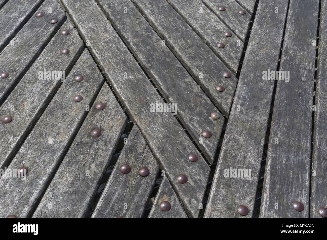 Close detail of the wooden slats forming some public seating at Lemon Quay, Truro, Cornwall. Stock Photo