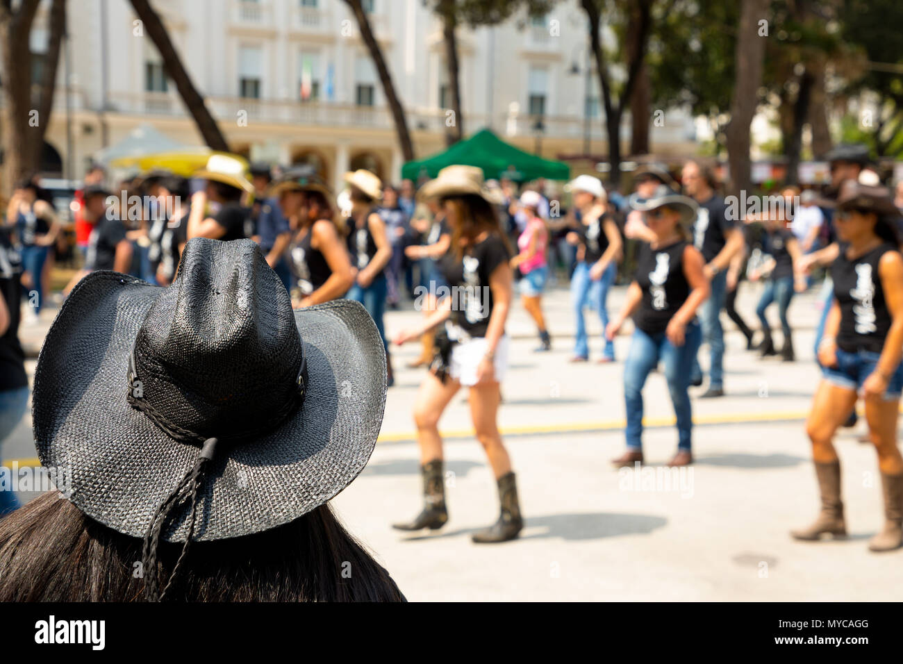 Black hat on flash mob backgroung Stock Photo