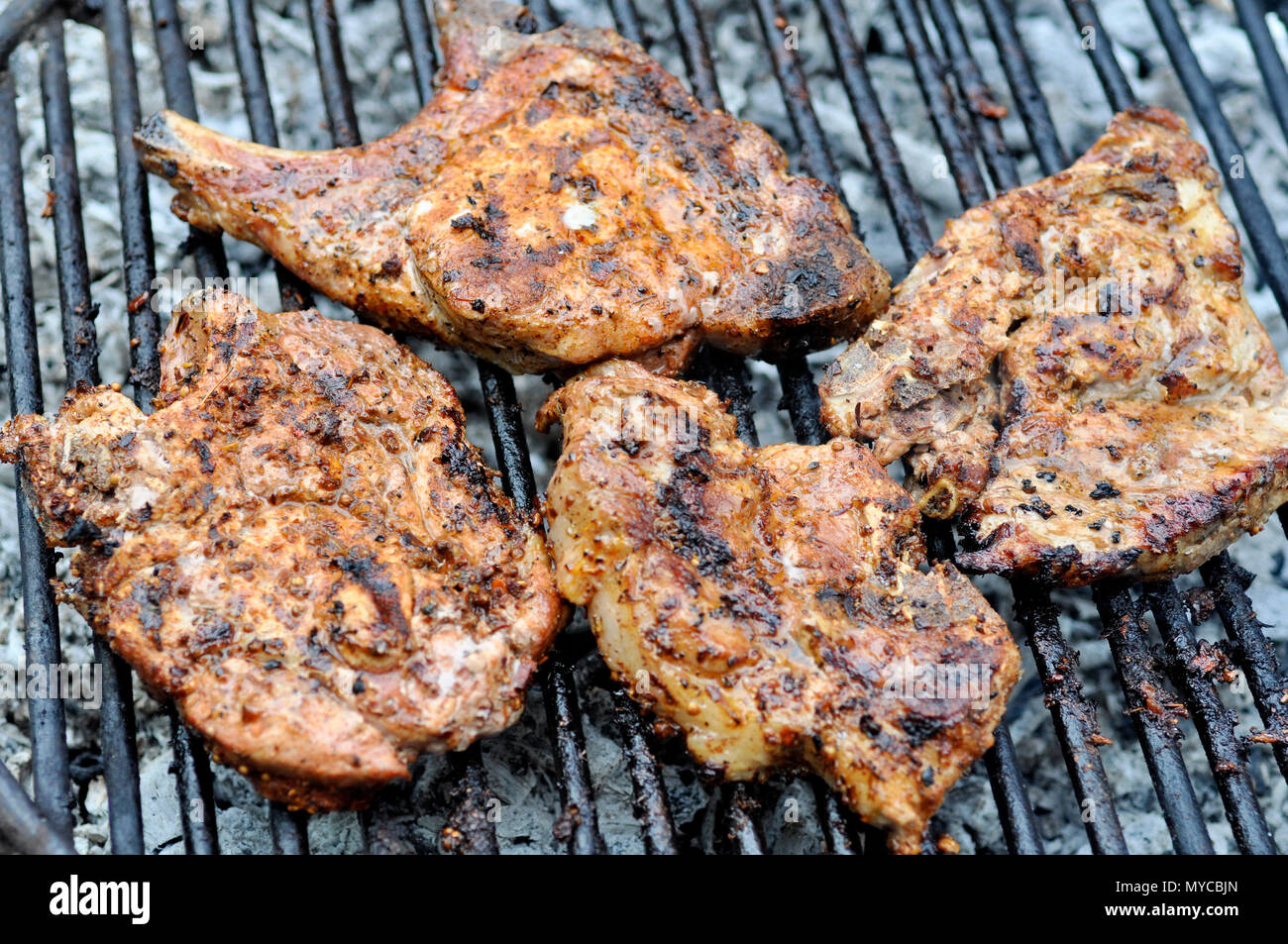 Top sirloin steak on a barbecue, shallow depth of field. outdoor grill