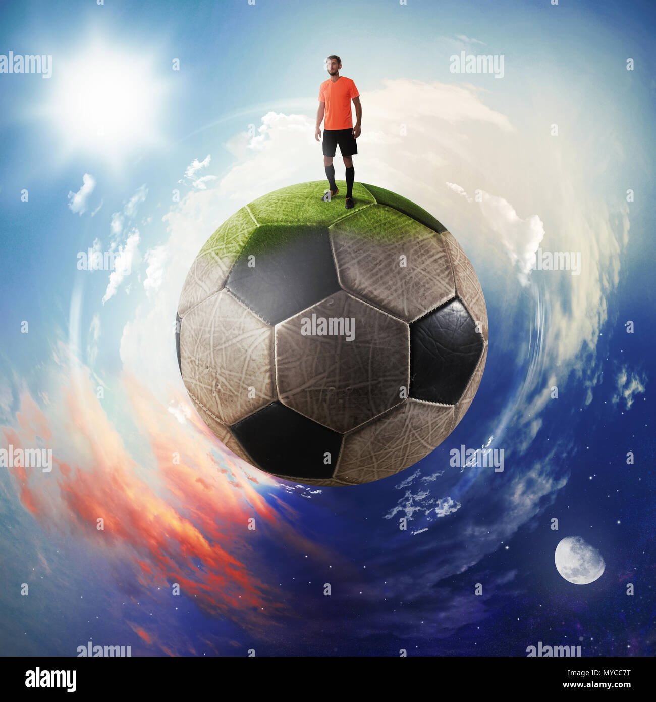 Football player in a soccer ball planet Stock Photo