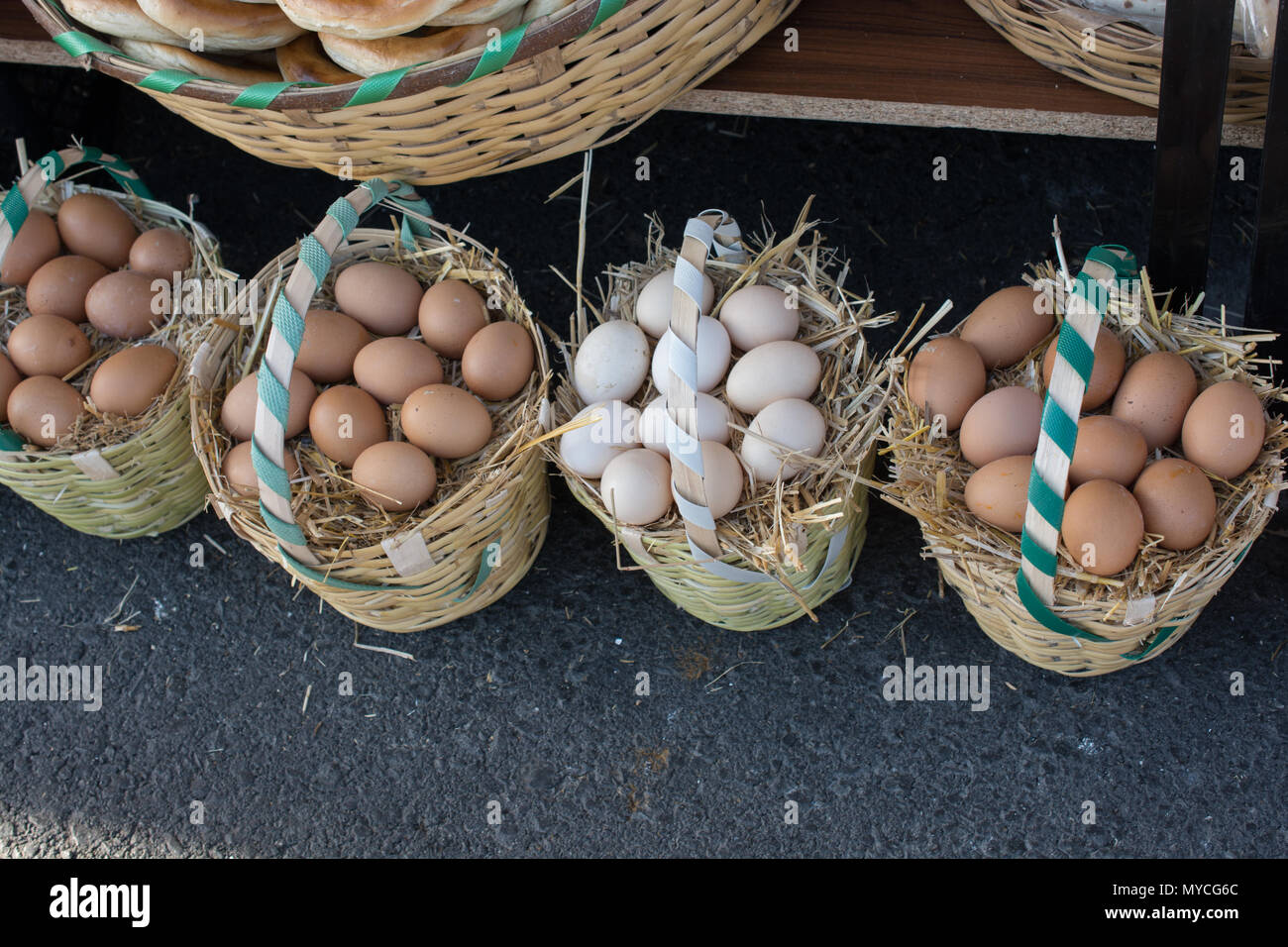 Organic fresh farm eggs in the straw basket Stock Photo - Alamy
