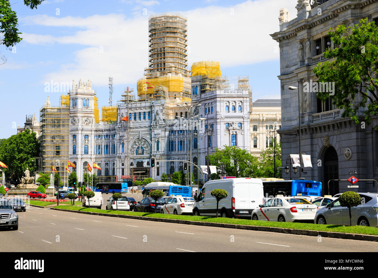 Palacio de Cibeles and fountain covered in painted scaffolding sheets. Madrid, Spain. May 2018 Stock Photo