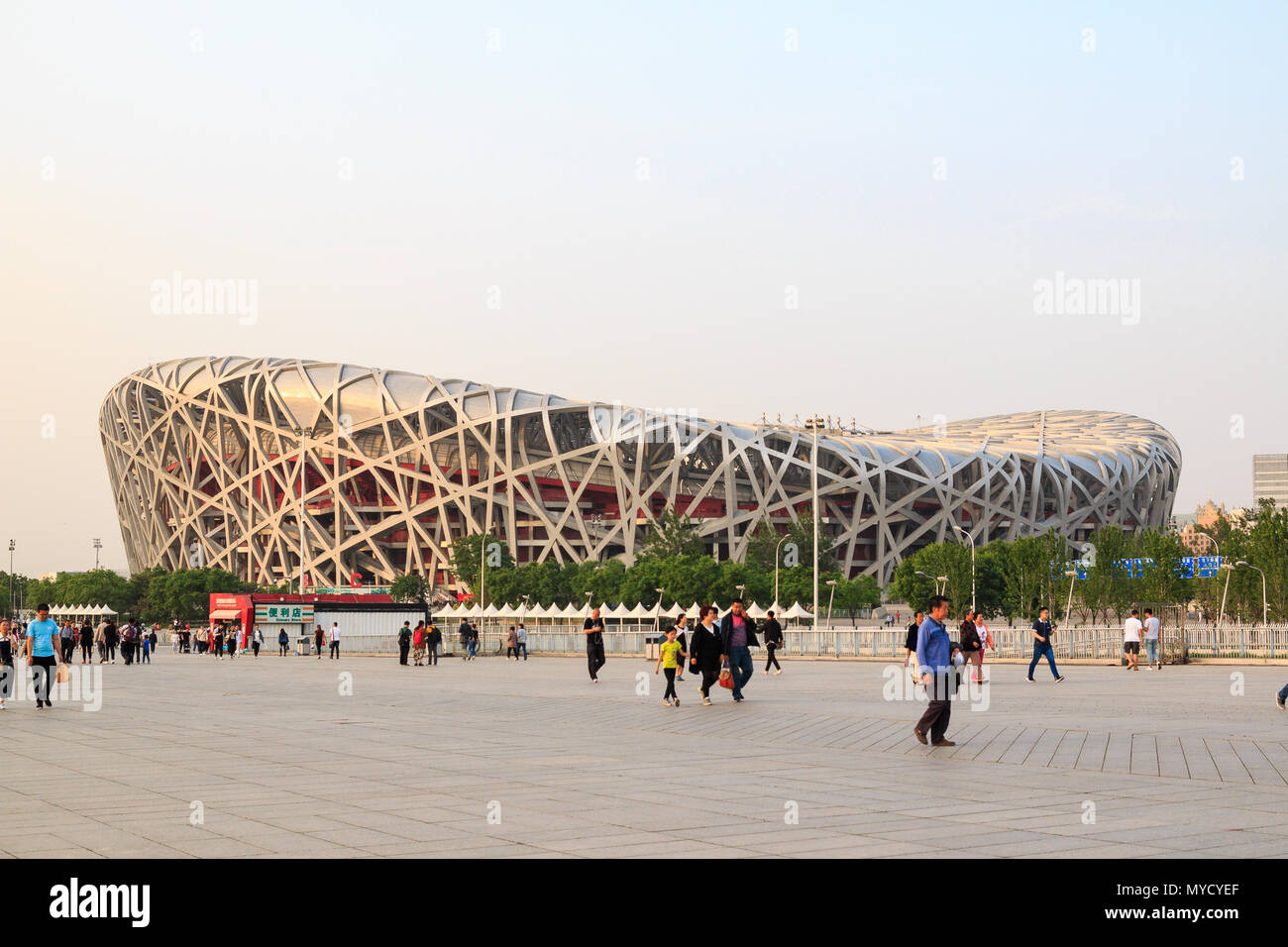 BEIJING, CHINA - MAY 7, 2018: The Bird's Nest is a stadium designed for use throughout the 2008 Summer Olympics and Paralympics. View from Green Park  Stock Photo