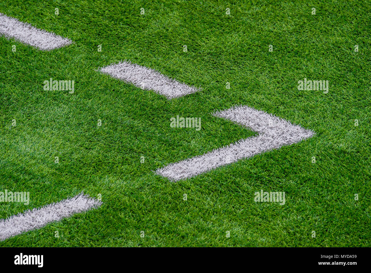 The white Line marking on the artificial green grass soccer field Stock
