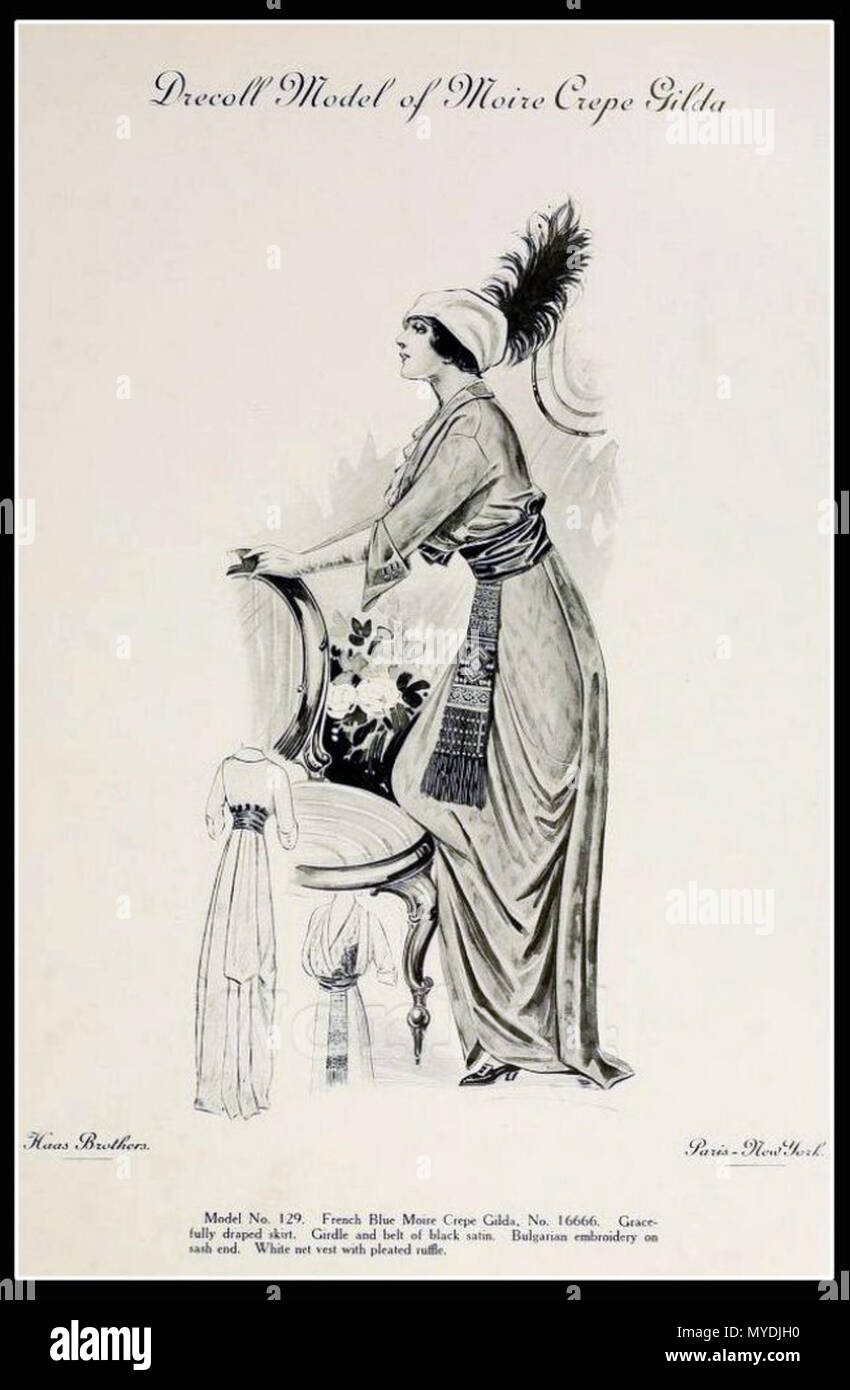 . English: Fashion Design by Christoph Drecoll (1851–1939). French Blue Moire Crepe Gilda. Gracefully draped skirt. Girdle and belt of black satin. Bulgarian embroidery on sash end. White net vest with pleated ruffle. Cocktail dress by couturier Baron Christoph von Drecoll. Published by Haas brothers. 6 May 2014, 10:22:18. Christop Drecoll (1851-1939) 146 Drecoll Model of Moire Crepe Gilda. Paris Spring Season 1913 Stock Photo