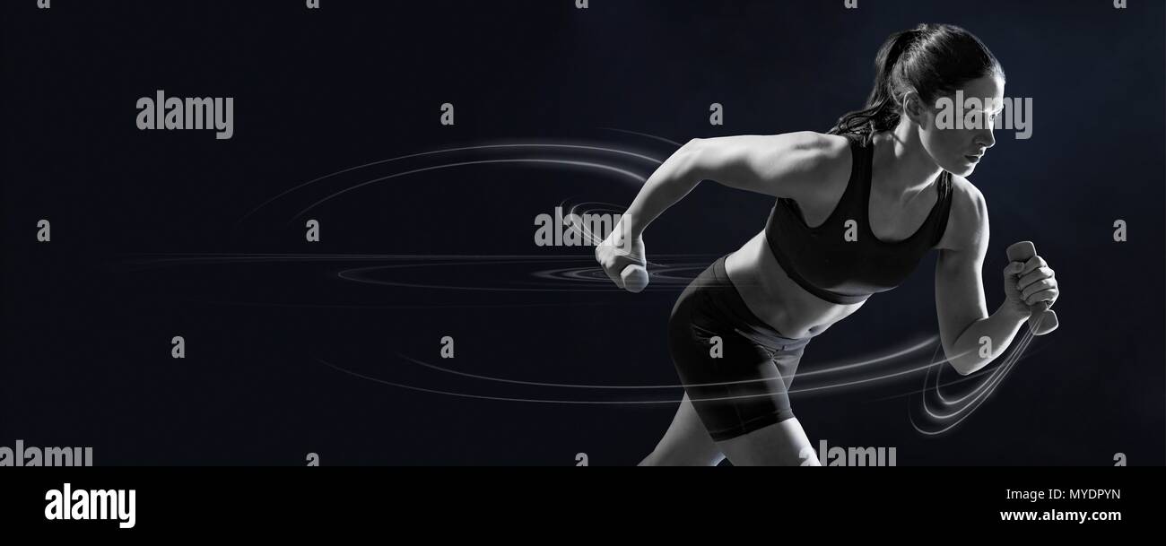 Young woman running with hand weights Stock Photo Alamy