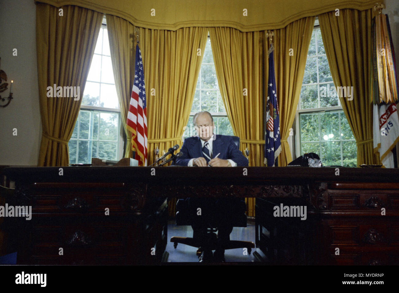1974, September 8 – The Oval Office – The White House – Washington, DC – Gerald R. Ford – signing Nixon Pardon – President Gerald R. Ford signs the Nixon Pardon Stock Photo