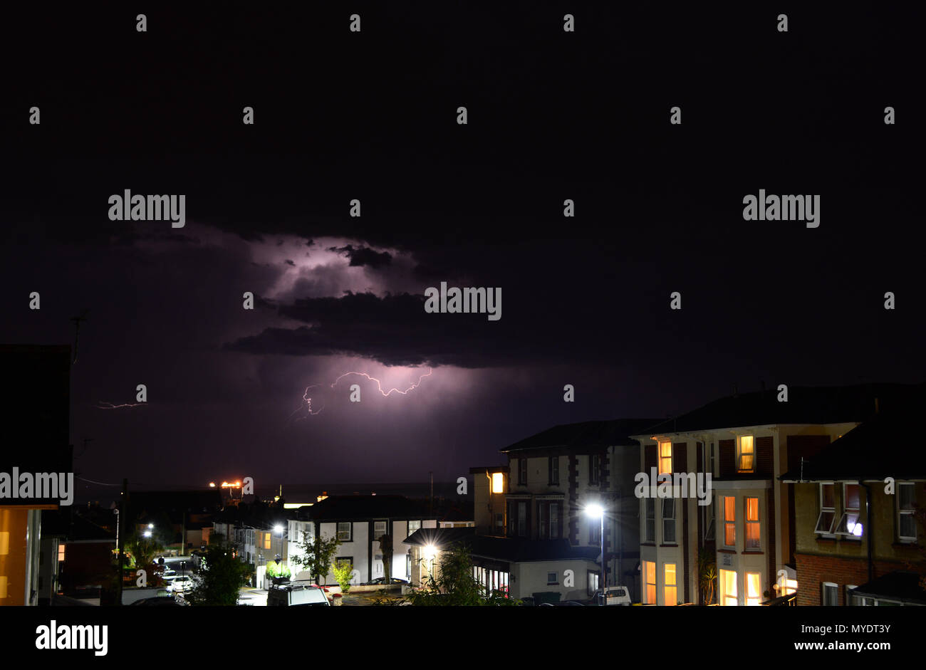 Lightning Storm over houses at Sandown Bay on the Isle of Wight, UK. Stock Photo
